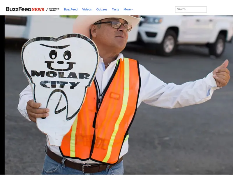 Guillermo Memo Pérez — Los Algodones tourist greeter with Welcome to Molar City sign